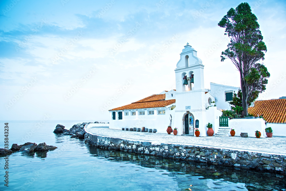Beautiful charming optimistic view of Vlacherna Monastery on the Kanoni peninsula in Kerkyra, Corfu, Greece. popular tourist attractions. amazing places.