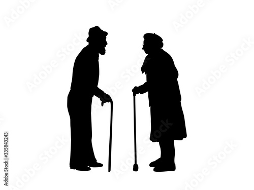 Silhouettes of grandparents are standing against each other.