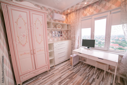 Interior for a little girl's bedroom in pink color