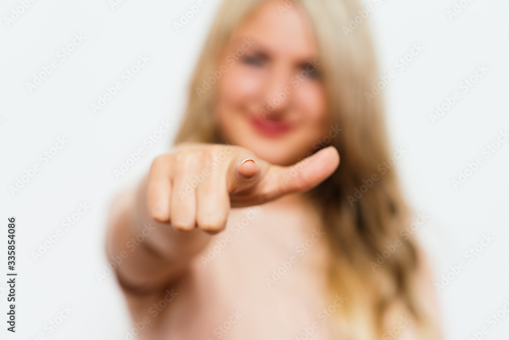 studio portrait of a beautiful girl pointing to the camera studio portrait of a beautiful girl pointing to the camera