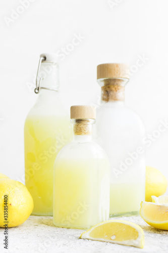 Italian traditional liqueur limoncello with lemons