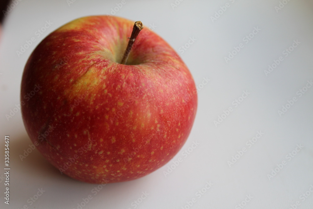 fruit red Apple close up on a white light background fruit red Apple close up on a white light background