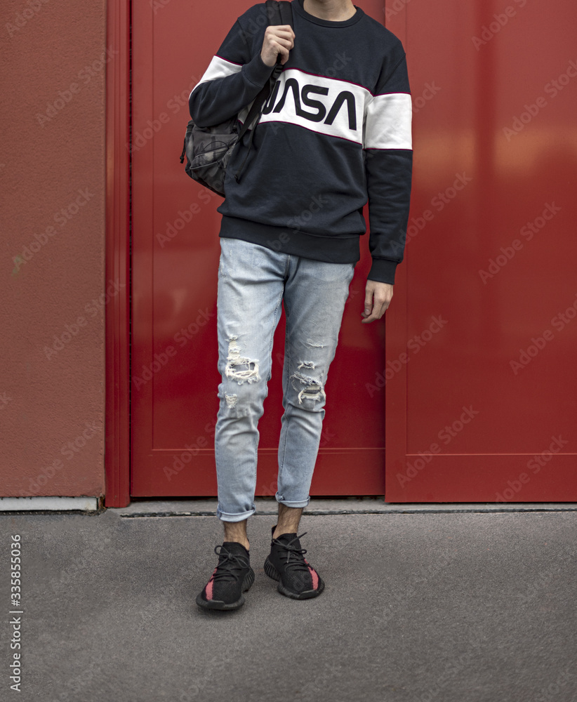 Man wearing a pair of Adidas Yeezy 350 Stock Photo | Adobe Stock