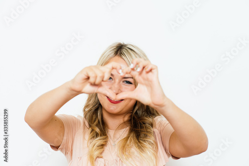 woman making a hand heart frame