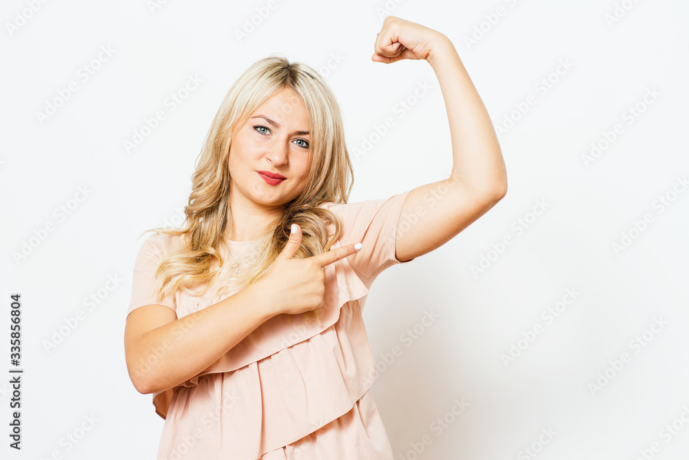 woman showing her muscles woman showing her muscles