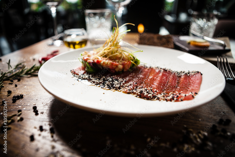 Tuna sashimi served on a plate in restaurant Tuna sashimi served on a plate in restaurant