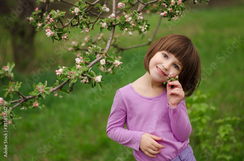 Little girl with apple blossom