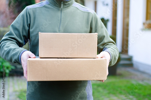 Close-up of Delivery Man Delivers Package.