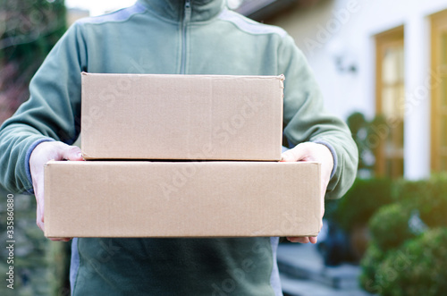 Close-up of Delivery Man Delivers Package.