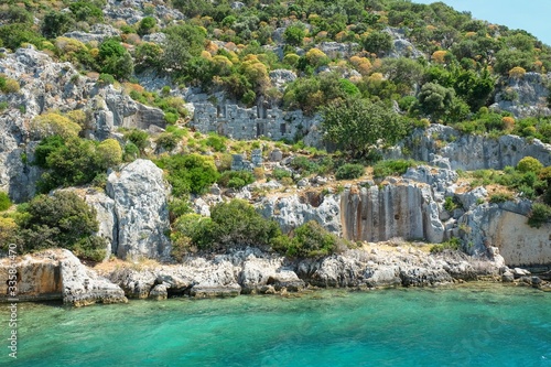 Weathered ruins of famous ancient underwater town Sunken City on Kekova island, in mediterranean coastline of Antalya province,Turkey. Popular tourist places in Turkey. © Matrix Reloaded