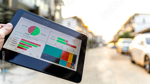 Business man analysis graph visualization on mobile for anywhere anytime photo