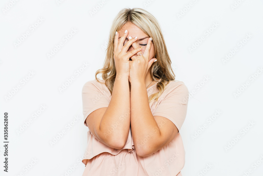Woman covers his face by hand Woman covers his face by hand