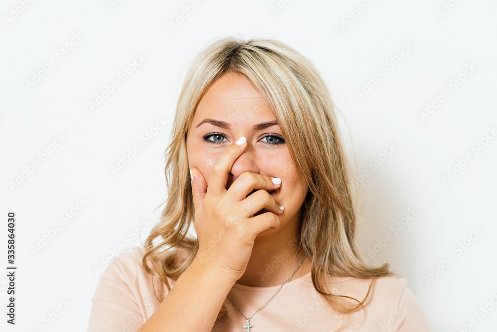 Girl laughs and covers her mouth Girl laughs and covers her mouth