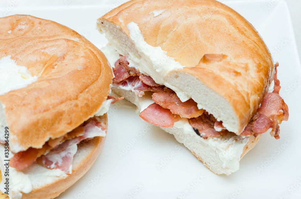 A selection of various sandwiches and fillings, garnished with crisps and salad.