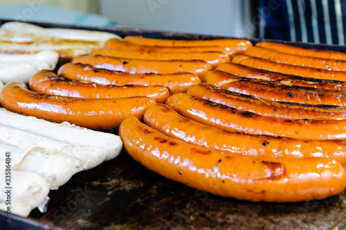 Frankfurters cooking on a market stall photo