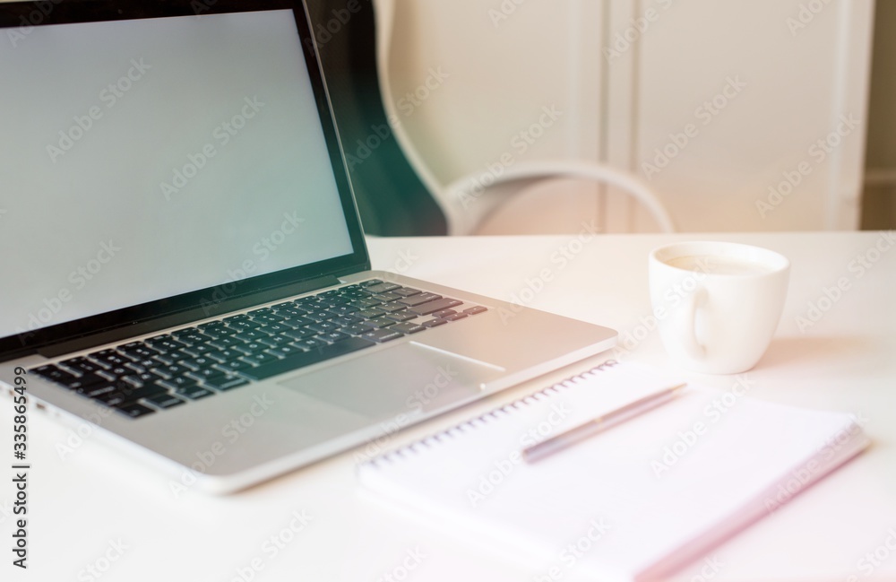 Laptop mockup on work desk in sunset. Close-up laptop, coffee, with morning light. Modern, thin laptop design.White. Isolated screen for mockup. Laptop profile. Home office Laptop mockup on work desk in sunset. Close-up laptop, coffee, with morning light. Modern, thin laptop design.White. Isolated screen for mockup. Laptop profile. Home office