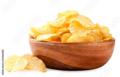 Potato chips in a wooden plate on a white background. Isolated