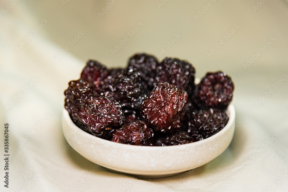 black dates in a bowl black dates in a bowl