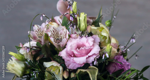 beautiful bouquet of delicate flowers on a gray background