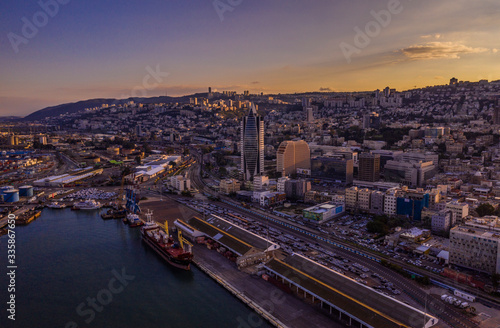 Haifa cargo harbor and cityscape at sunset aerial view