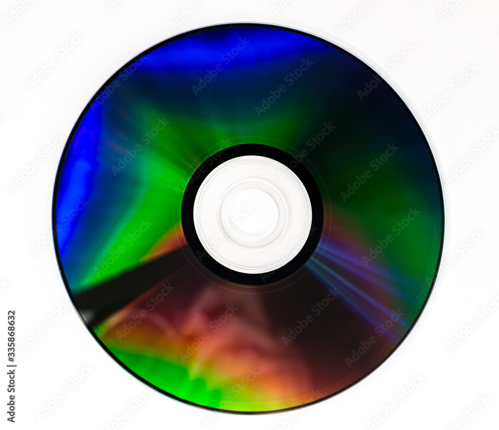 CD DVD compact optical disk storage medium with dust and scratches. Rainbow spectrum of iridescent colors CD DVD compact optical disk storage medium with dust and scratches. Rainbow spectrum of iridescent colors
