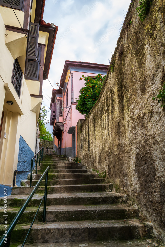 A narrow walkway with stairs in the old town of Kavala, northern Greece