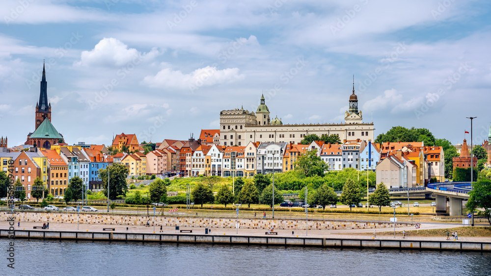 People walking on Piastowski Boulevard. Old town, Castle of Pomeranian Dukes and Cathedral Basilica of St James the Apostle in background, Szczecin