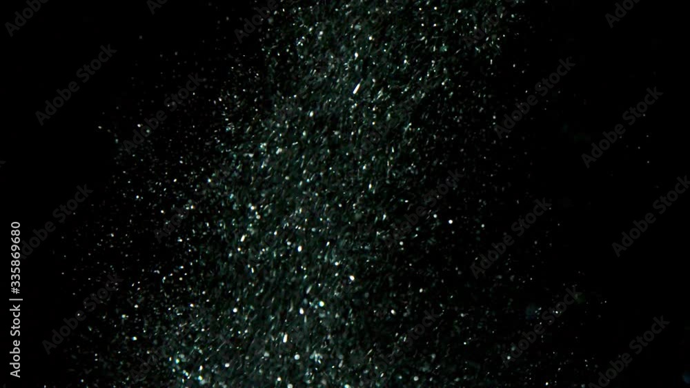 Falling flying Golden confetti. Abstract background with golden shiny sparkling sparkles. Particles of shiny dust sparkles. Flying and flickering particles of light. black background in 4K Loopable Falling flying Golden confetti. Abstract background with golden shiny sparkling sparkles. Particles of shiny dust sparkles. Flying and flickering particles of light. black background in 4K Loopable