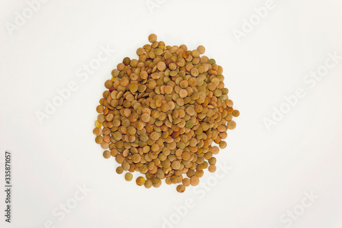 Lentils on a white background. Useful legumes for cooking soups and porridges.