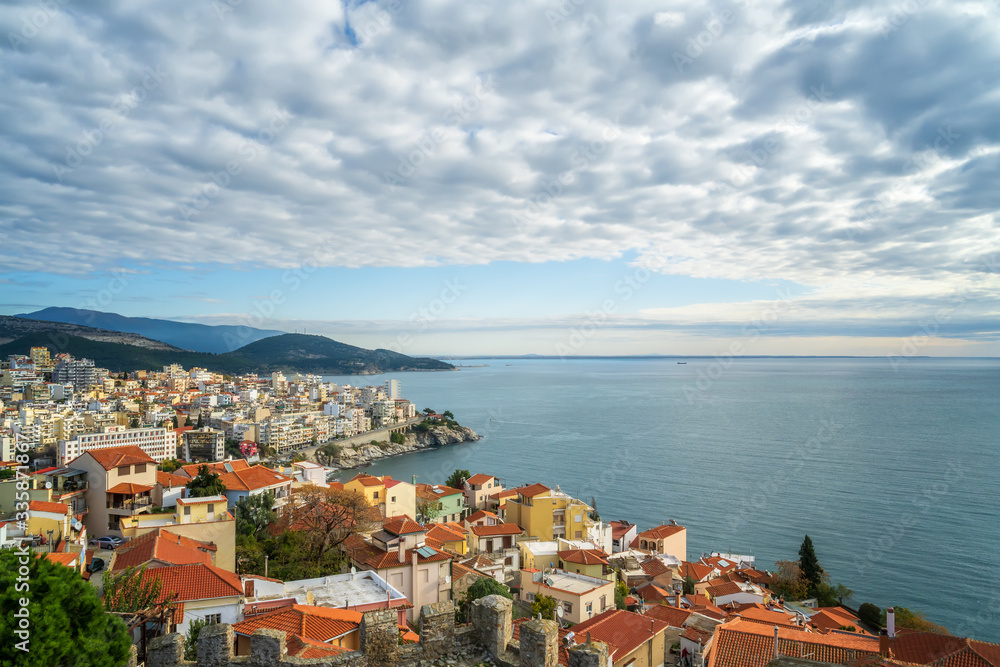 Aerial view with the city of Kavala in northern Greece,  surrounded by turqoise sea