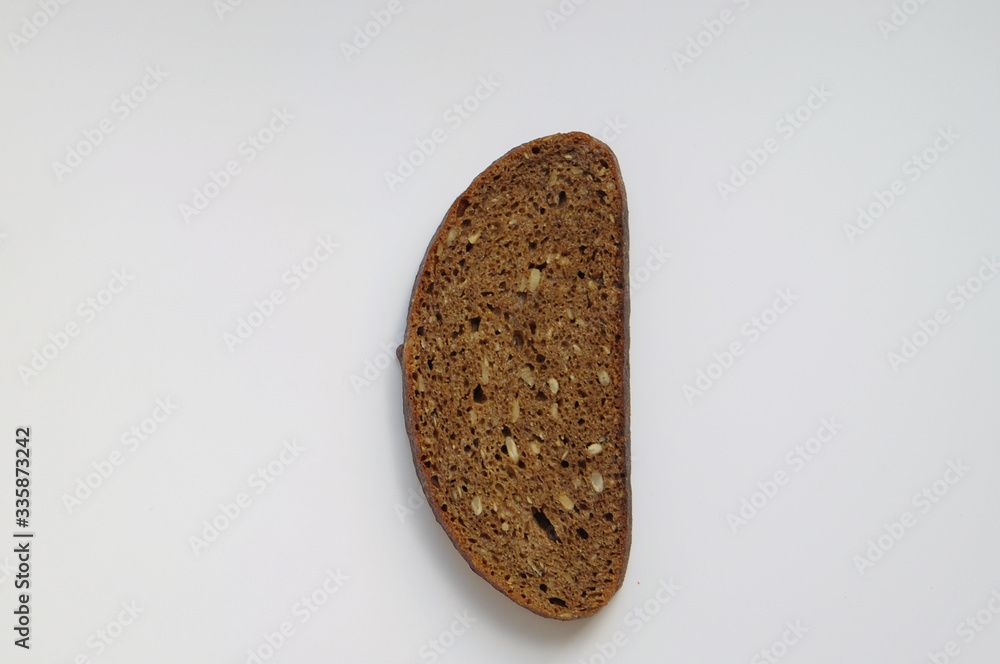 one isolated slice of grain bread on a white background one isolated slice of grain bread on a white background