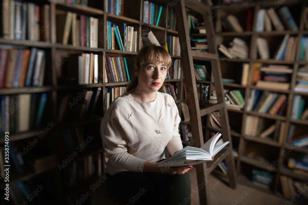 Young woman reading book in library people isolation education Young woman reading book in library people isolation education
