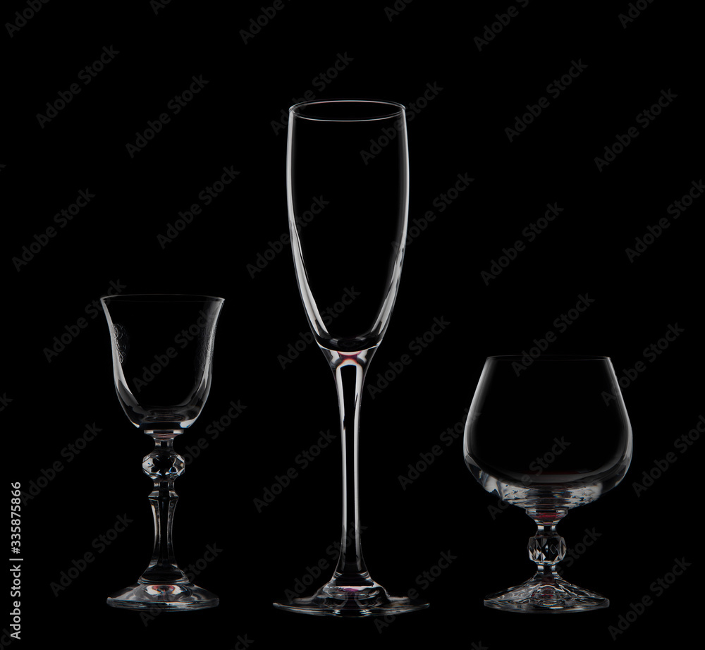 Three glass goblets on a black background
Three glass goblets on a black background