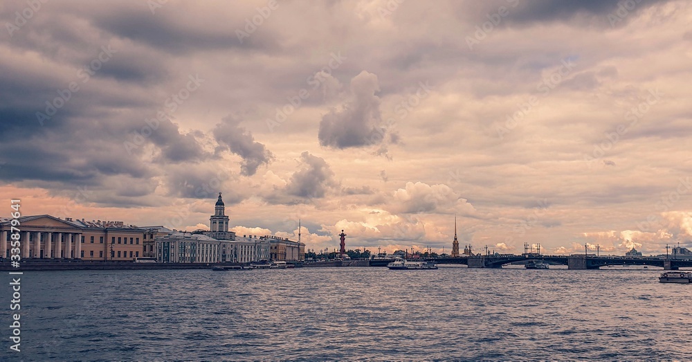 Cloudy sky over the Neva, Spit of Vasilyevsky Island, Peter and Paul Fortress and Palace Bridge