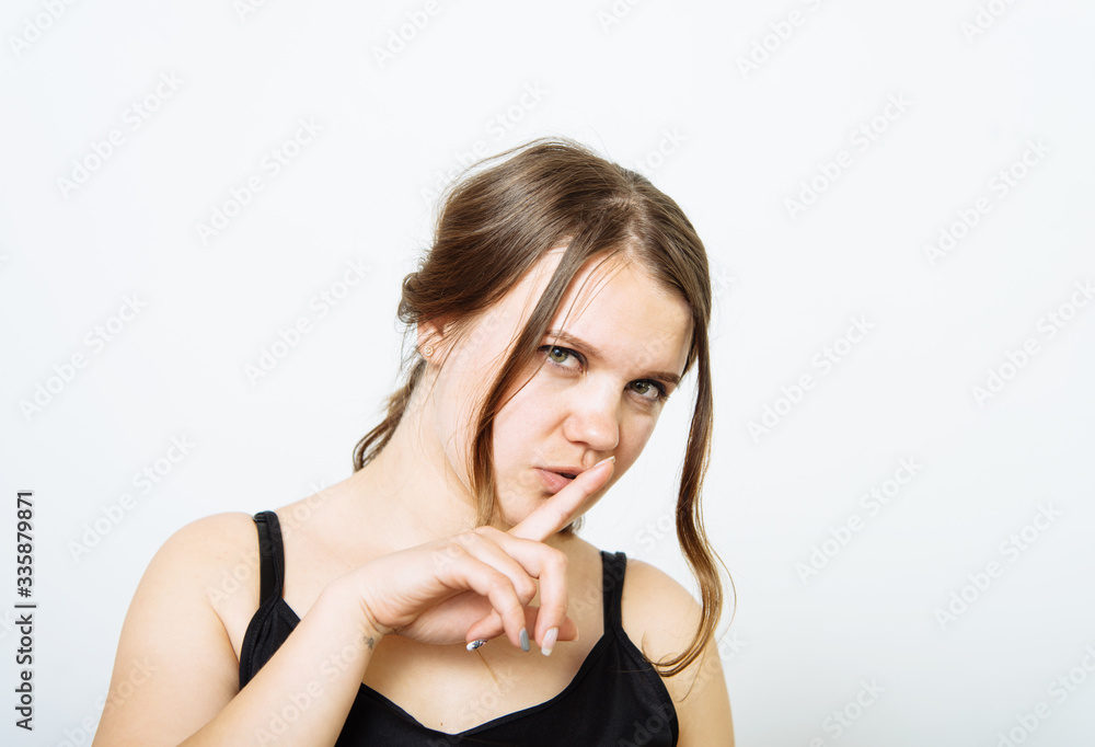 woman put finger on her lips woman put finger on her lips