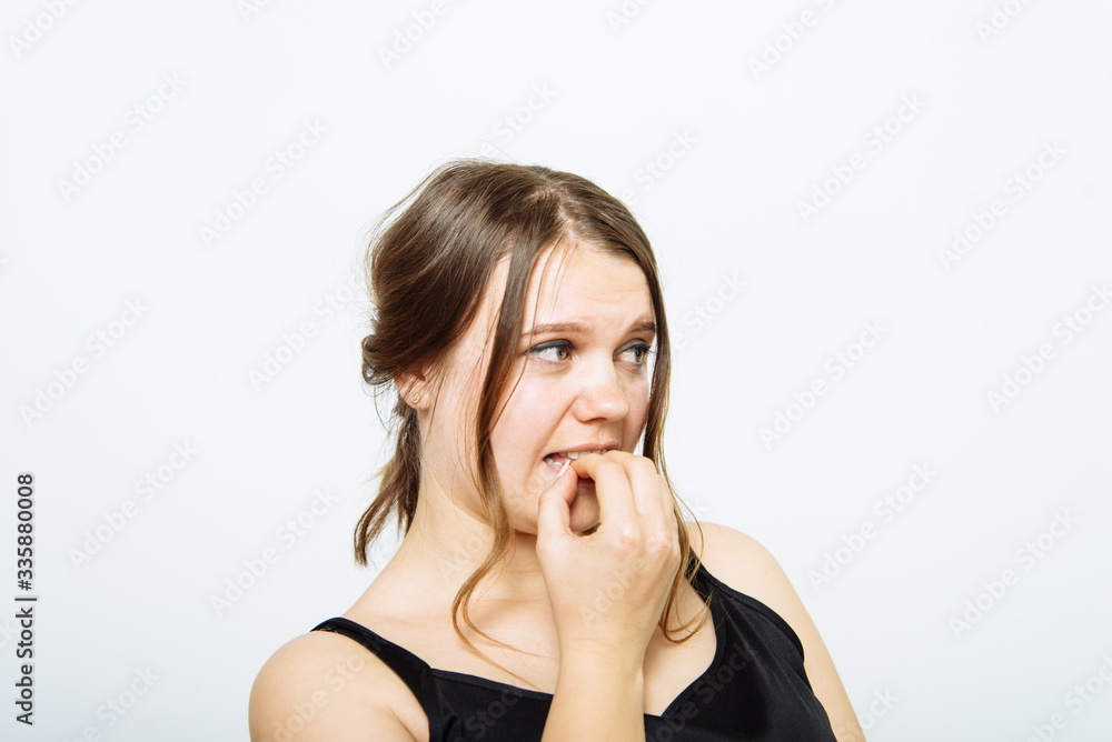Woman bites his nails Woman bites his nails