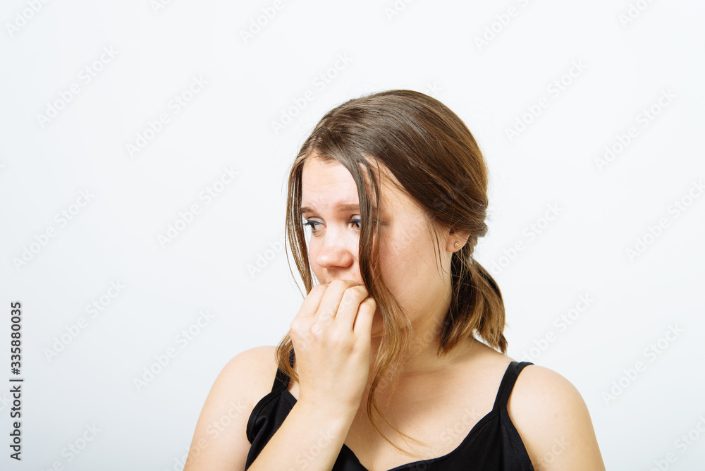 Fototapeta premium Woman bites his nails