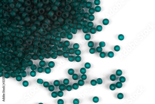 Isolated beads on a white background, scattered beads, green beads