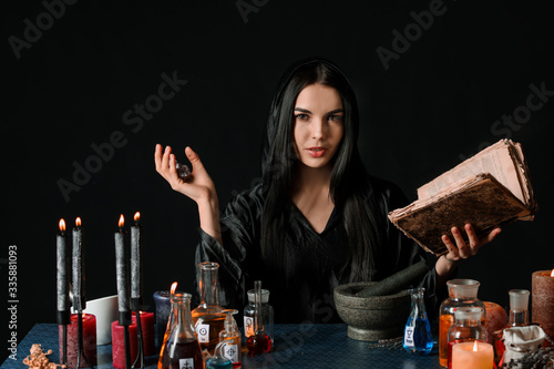 Female alchemist making pot...
