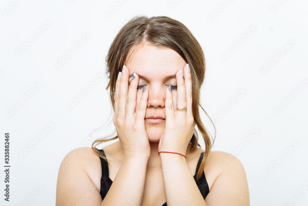 Woman covers his face by hand Woman covers his face by hand