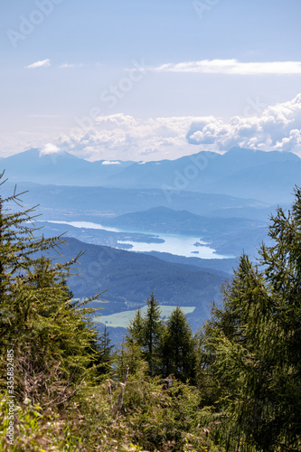 Panorama of the Austrian Alps,Europe,at Lake Ossiacher See with the mountains of the Karawanken Mountains with paragliders © 2199_de