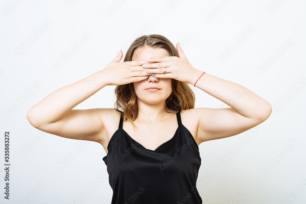 woman closes eyes with her hands woman closes eyes with her hands