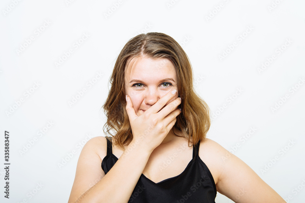 Girl laughs and covers her mouth Girl laughs and covers her mouth