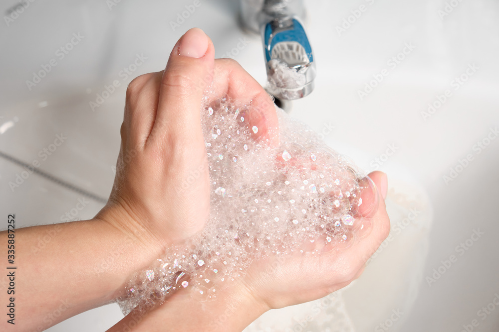 Fototapeta premium Wash your hands with soap and running water. Hygiene