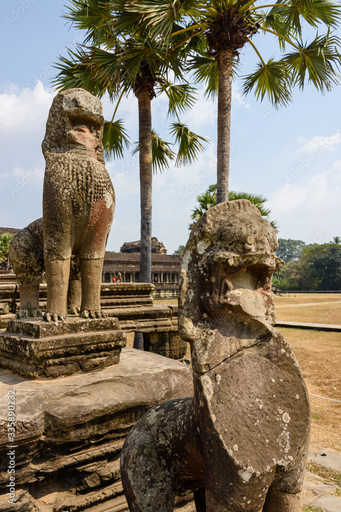 Statues of Chinese lions guard the entrance to the UNESCO World Heritage Site of Angkor Wat, Siem Reap, Cambodia