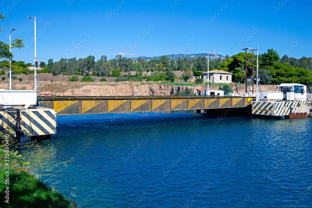 Fototapeta premium Submersible Bridge Over the Corinth Canal. Sunny day, blue sky