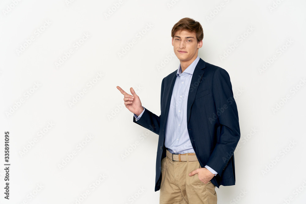 young businessman pointing at a blank board young businessman pointing at a blank board