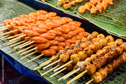 Skewers of port and chicken on sale at a street food stall, Bangkok, Thailand