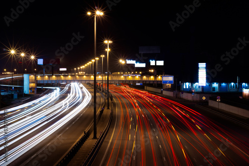 Traffic in motion on a long exposure on a night highway in the city. © Elenstone