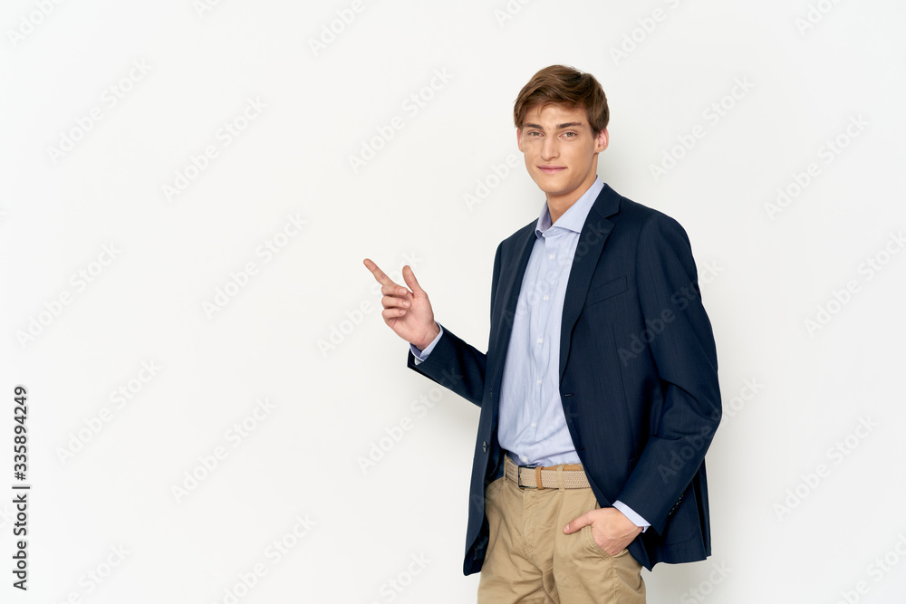 young man pointing at a blank board young man pointing at a blank board